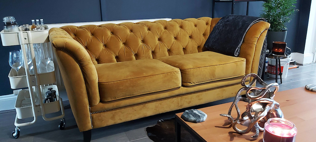 Karin - yellow chesterfield-style sofa on black legs